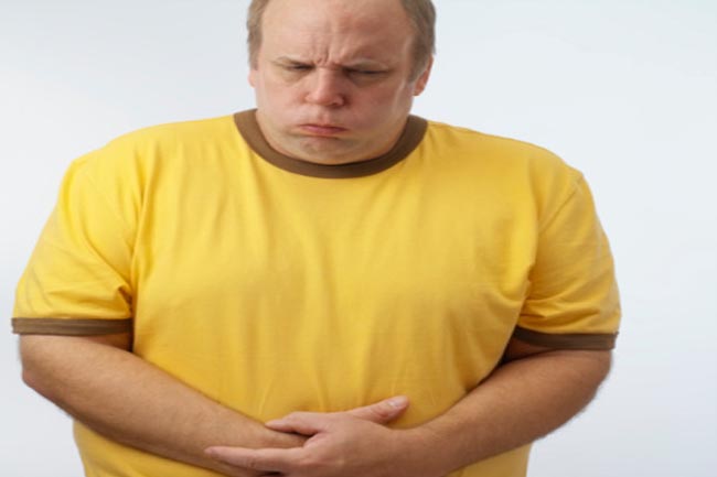 Man with hands on stomach, upper half,