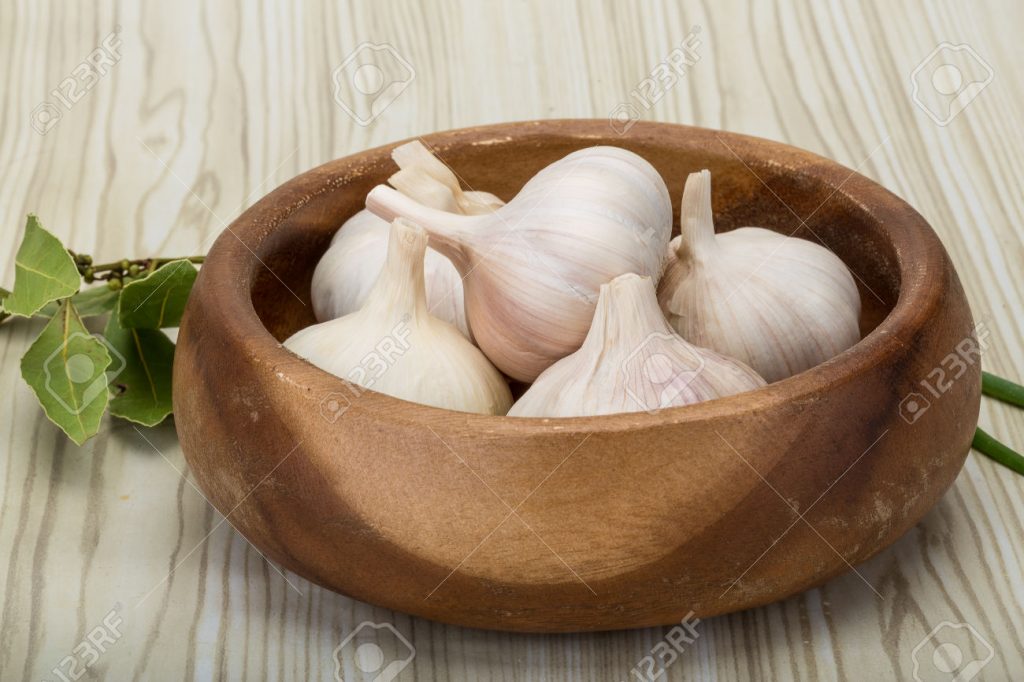 Heap of garlick - on the wooden background