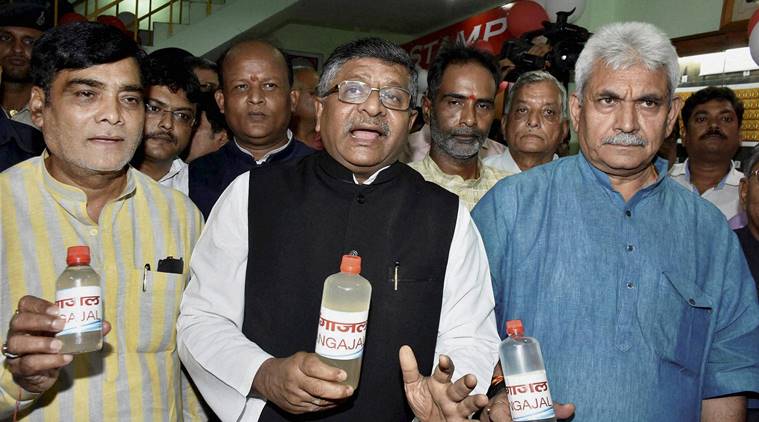 Patna: Communications & IT Minister Ravi Shankar Prasad with Minister of State for Railways and (Independent charge) for Communications Manoj Sinha, MoS Ramkripal Yadav during launch of Gangajal distribution at General Post Master office in Patna on SUnday. PTI Photo (PTI7_10_2016_000148B)
