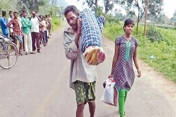 man carrying wifes dead body in shoulder m odisha Kalahandi