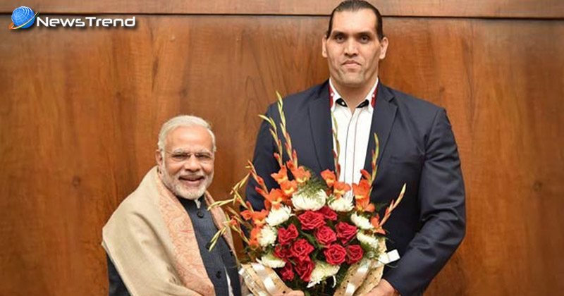 the great khali meets pm modi backs currency ban