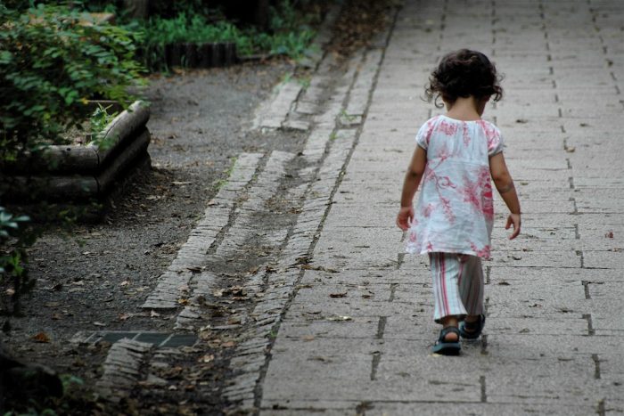 child girl walking on street
