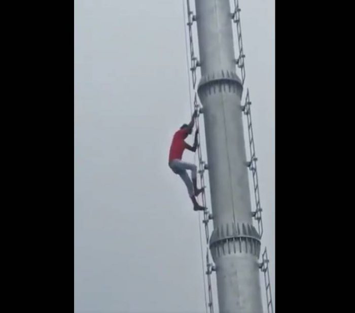 man climb on mobile tower