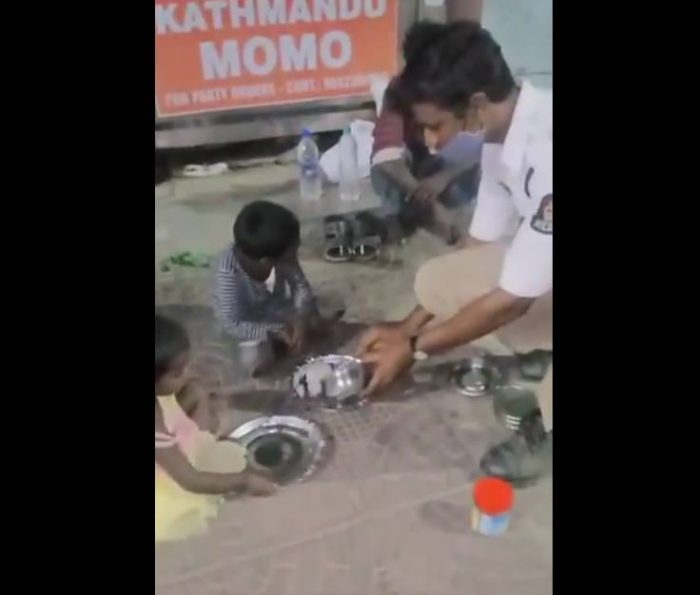 police shares lunch box with homeless children