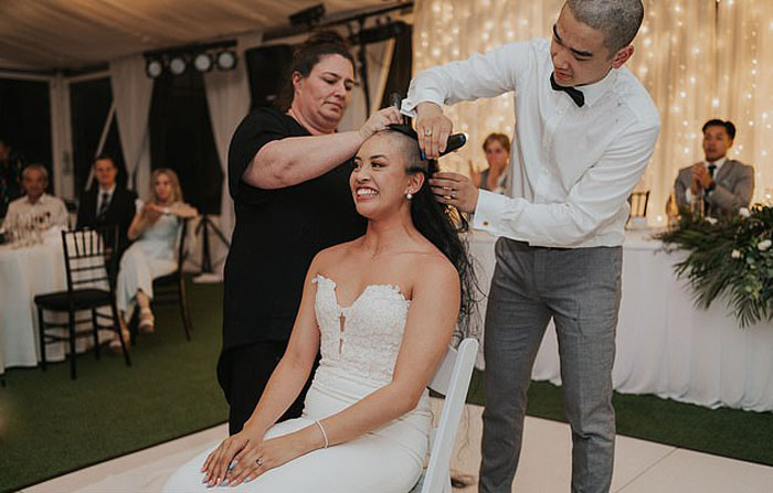Bride and groom shave heads on their wedding 