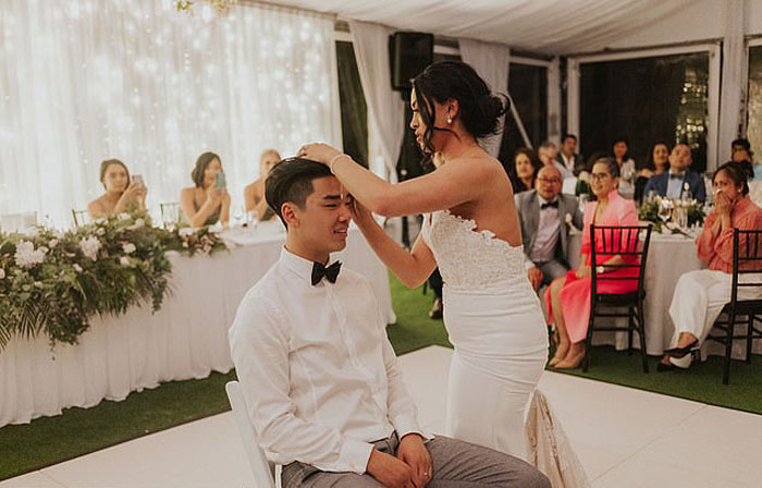 Bride and groom shave heads on their wedding 