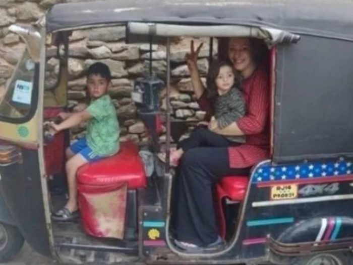 french woman in auto with children
