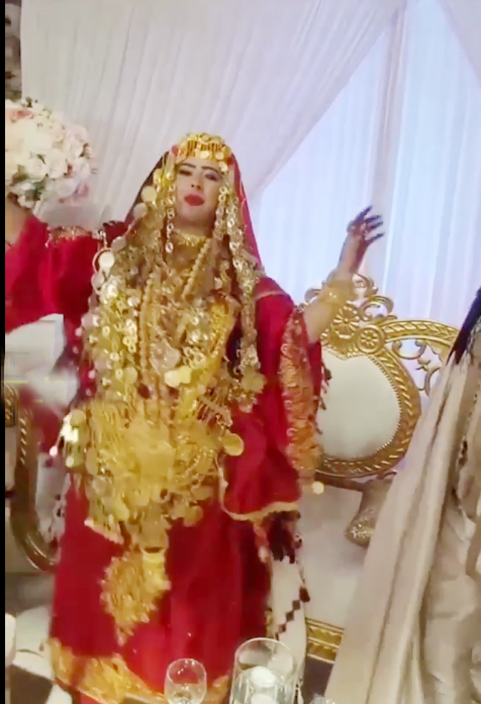 bride-dances-with-lots-of-gold-on-her