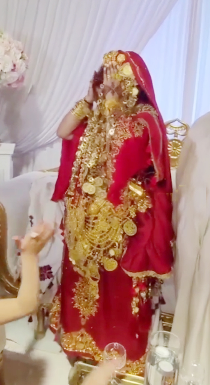 bride-dances-with-lots-of-gold-on-her