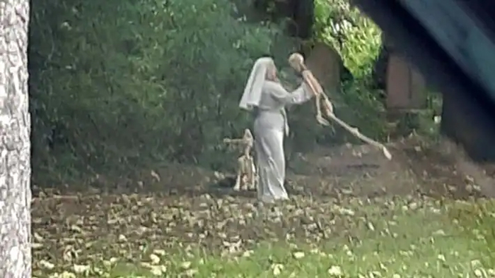 england-woman-spotted-dancing-with-human-and-dog-skeletons