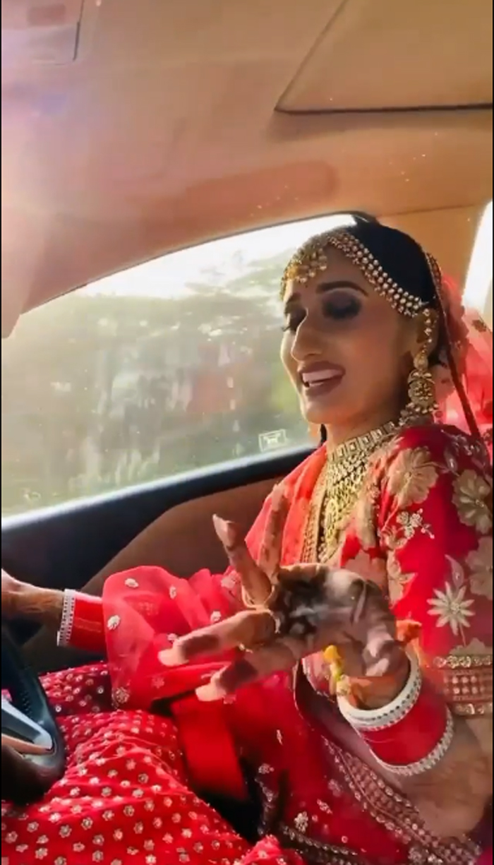 bride-drives-car-to-reach-wedding-hall-while-dancing
