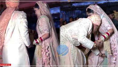 groom helps bride adjusting her lehenga