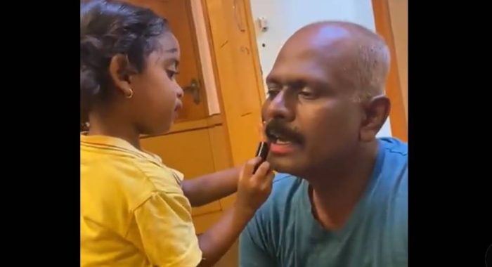 daughter doing makeup of father 