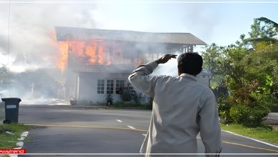 man watching on fire house