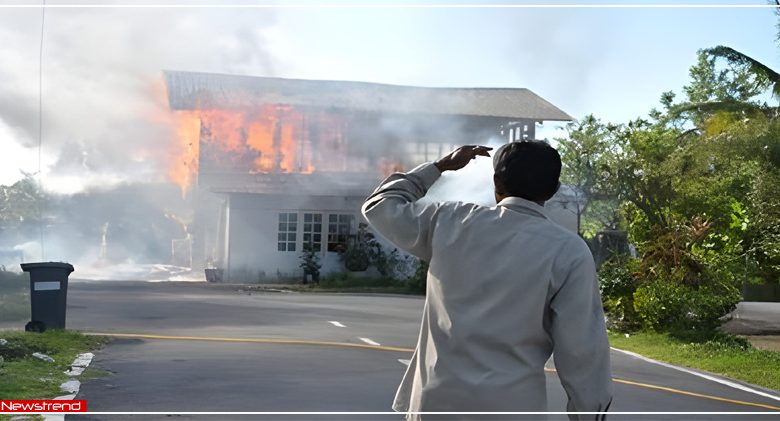 man watching on fire house